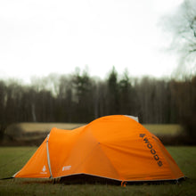 Load image into Gallery viewer, Side view of a fully built Woods Pinnacle Lightweight 2-Person 4-Season Tent on campground