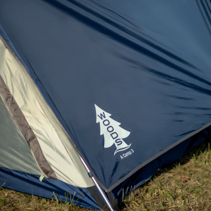 Close up of the logo on the corner of the Woods A-frame 3-person 3-season tent in Blue