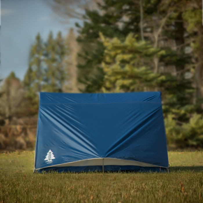Side view of the Woods A-frame 3-person 3-season tent in Blue on grass