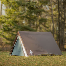 Load image into Gallery viewer, Fully built Woods A-Frame 3-Person 3-Season Tent in Brown angled left on a campground