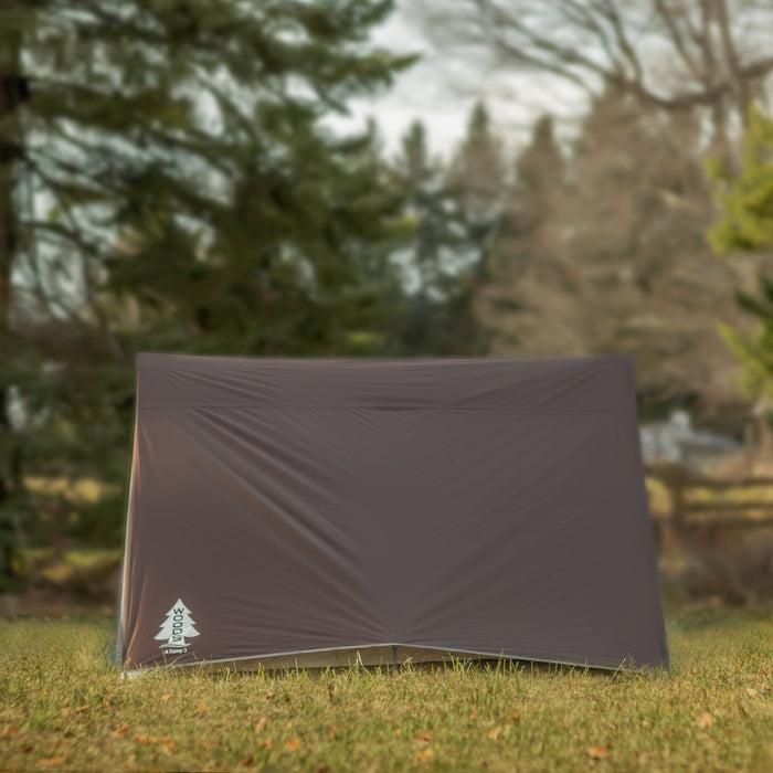 Side view of a fully built Woods A-Frame 3-Person 3-Season Tent in Brown on a campground