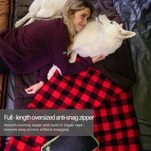 Load image into Gallery viewer, A woman and her dog on top of the Woods Heritage Cotton Flannel Sleeping Bag in Brown