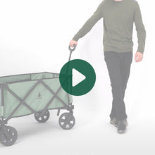 Load image into Gallery viewer, A person rolling the Woods Outdoor Collapsible Utility King Wagon in Sea Spray 