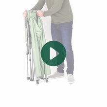 Load image into Gallery viewer, A man setting up the Ashcroft 3-position reclining lounger chair in Sea Spray