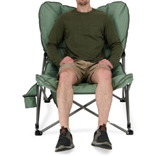 Load image into Gallery viewer, A person sitting on the Woods Mammoth Folding Padded Camping Chair in Sea Spray from the front