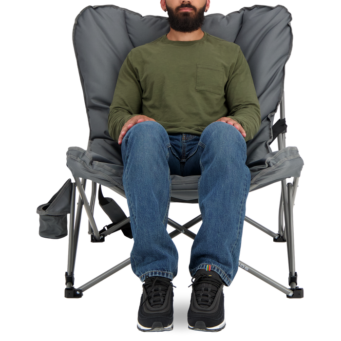 A person sitting on the Woods Mammoth Folding Padded Camping Chair in color Gun Metal from the front