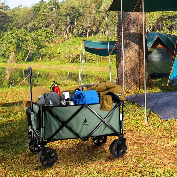 Woods Outdoor Collapsible Utility King Wagon in Sea Spray next to tents on campground