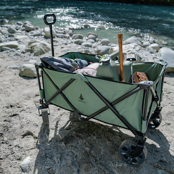 Woods Outdoor Collapsible Utility King Wagon in Sea Spray filled with gear by the water