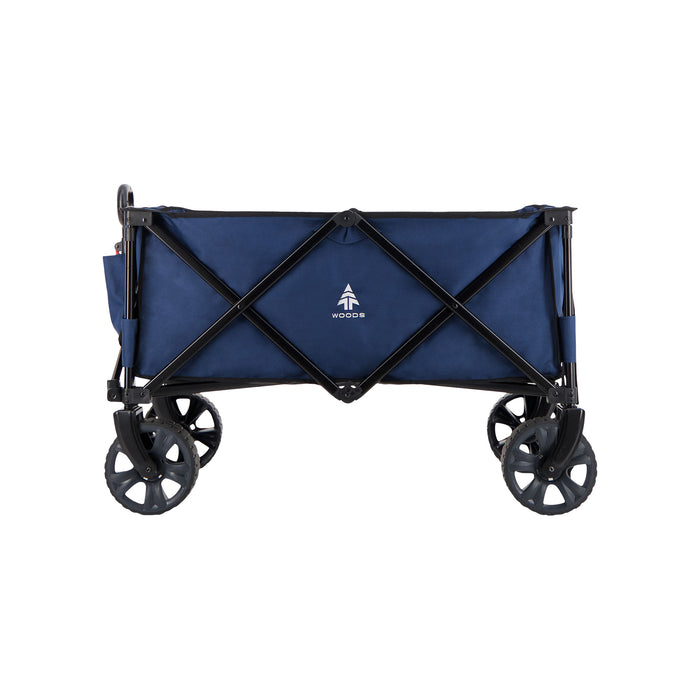 Side view of the Woods Outdoor Collapsible Utility King Wagon in Navy with handle collapsed
