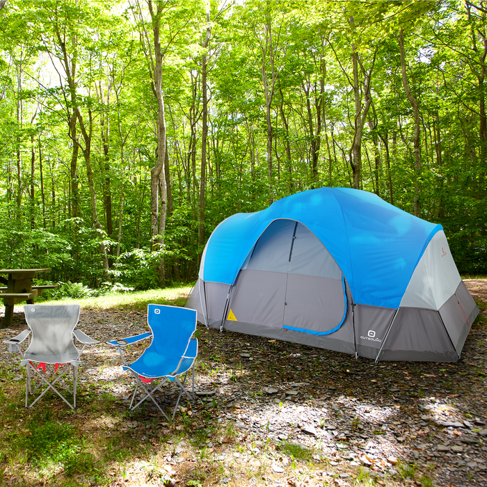 Fully built 8-person lightweight dome tent with rainfly in blue on campground