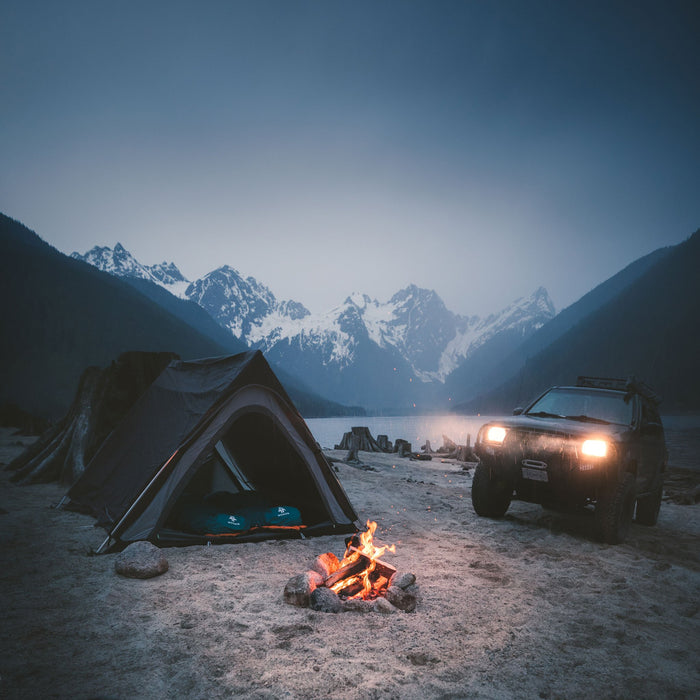 Fully built Woods A-Frame 3-Person 3-Season Tent on a campground near a car and the mountains