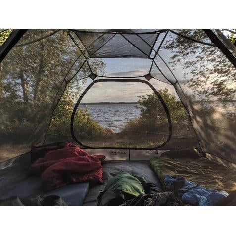 Fully built Woods Cascade Lightweight 2-Person 3-Season Tent without rainfly overlooking the water
