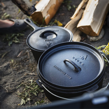 Load image into Gallery viewer, Close up of the pot and Dutch oven with lids on campground