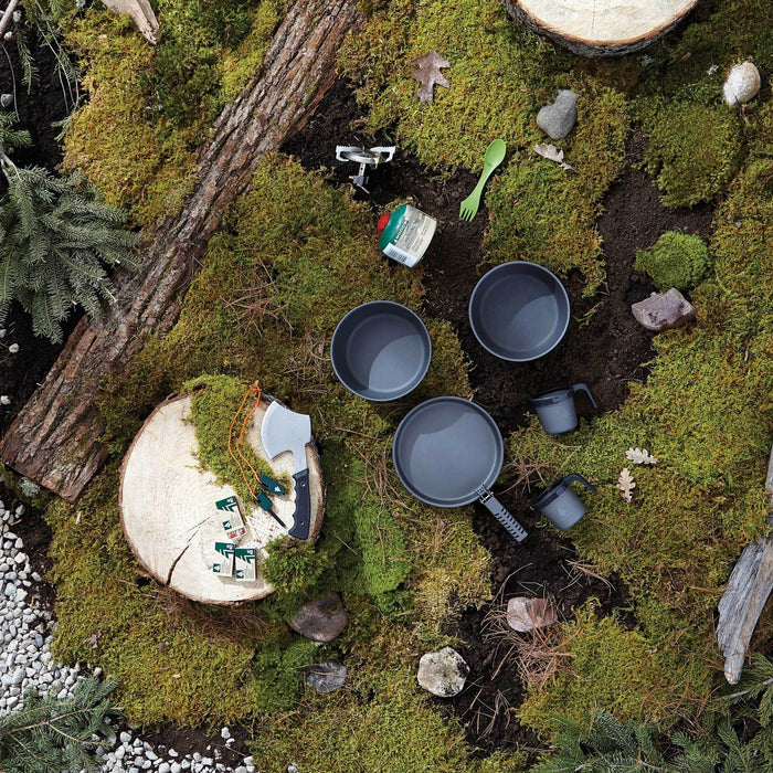 Birds eye view of the Woods Nootka Anodized 5-piece Camping Cook Set spread out on campground