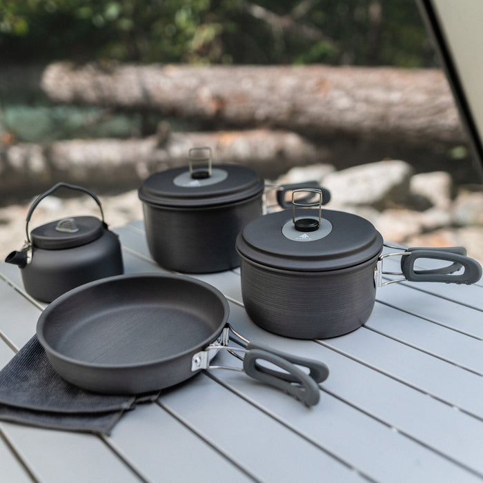 Woods Selkirk Anodized 4-piece Camping Cook Set on a picnic table