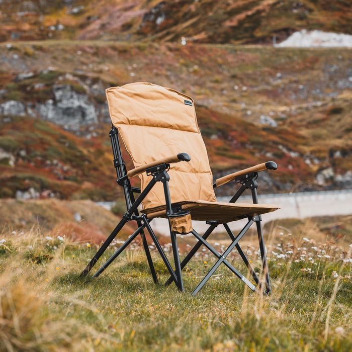 Woods Siesta Folding Reclining Padded Camping Chair in Dijon on grass