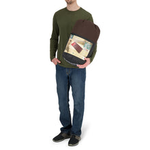 Load image into Gallery viewer, A person holding the Woods Heritage Cotton Flannel Sleeping Bag in Brown inside carry bag